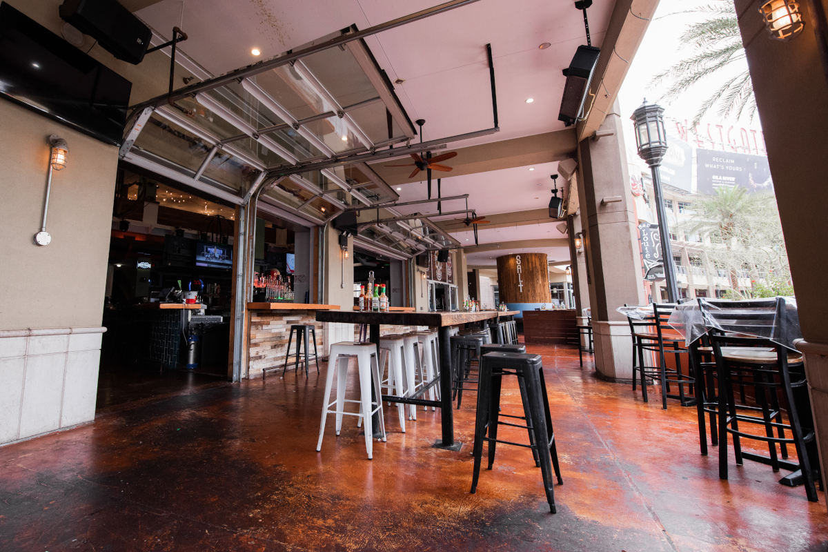 Restaurant exterior, high tables lined up